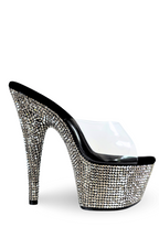 High-heeled shoe with crystal embellishments on a white background