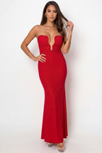Woman wearing a red strapless dress on a white background