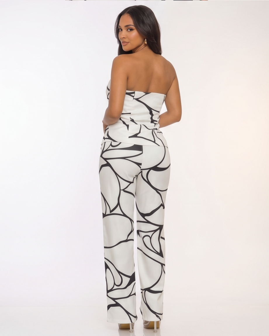 Woman wearing a strapless jumpsuit with black and white abstract pattern in four different poses.