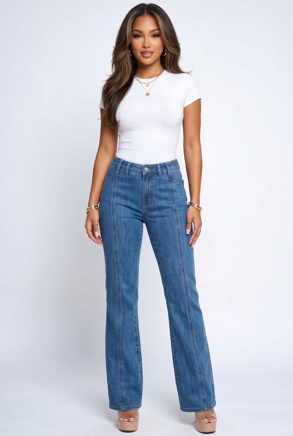 Woman wearing blue jeans and a white top on a white background