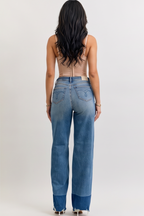 Woman modeling wide-leg jeans from front, side, and back views against a white background.
