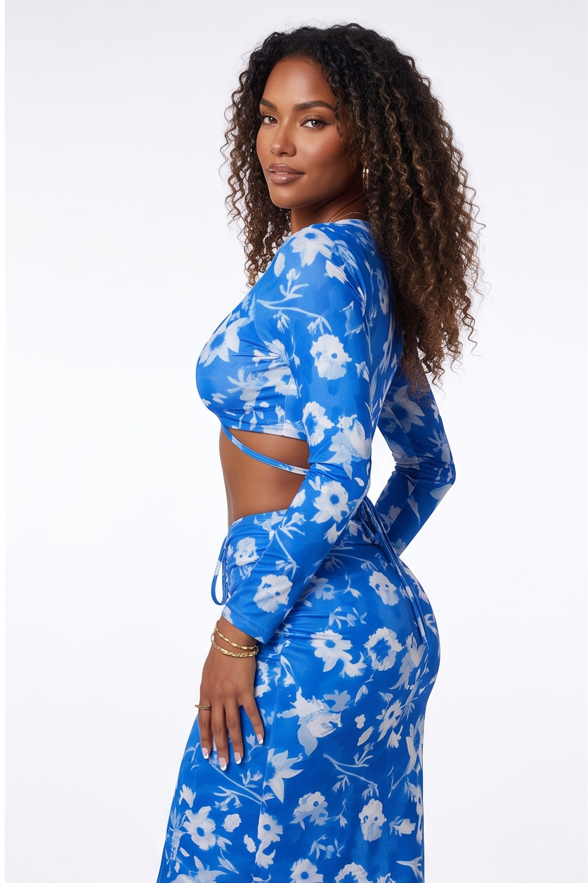 Woman wearing a blue floral dress on a white background