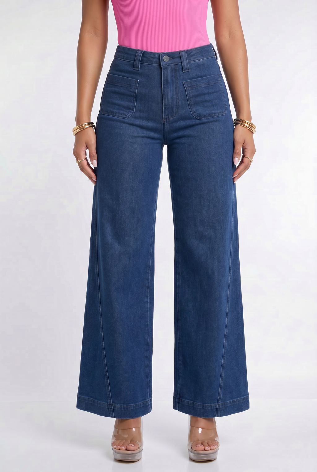 Blue jeans worn by a person on a white background