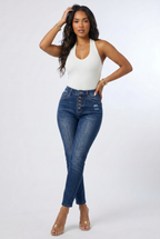 Woman wearing a white top and blue jeans on a white background