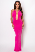 Woman wearing a bright pink dress with a plunging neckline on a white background