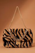 Juvia zebra print faux fur shoulder bag with gold chain strap and turn-lock closure on caramel background – FETISHE Footwear