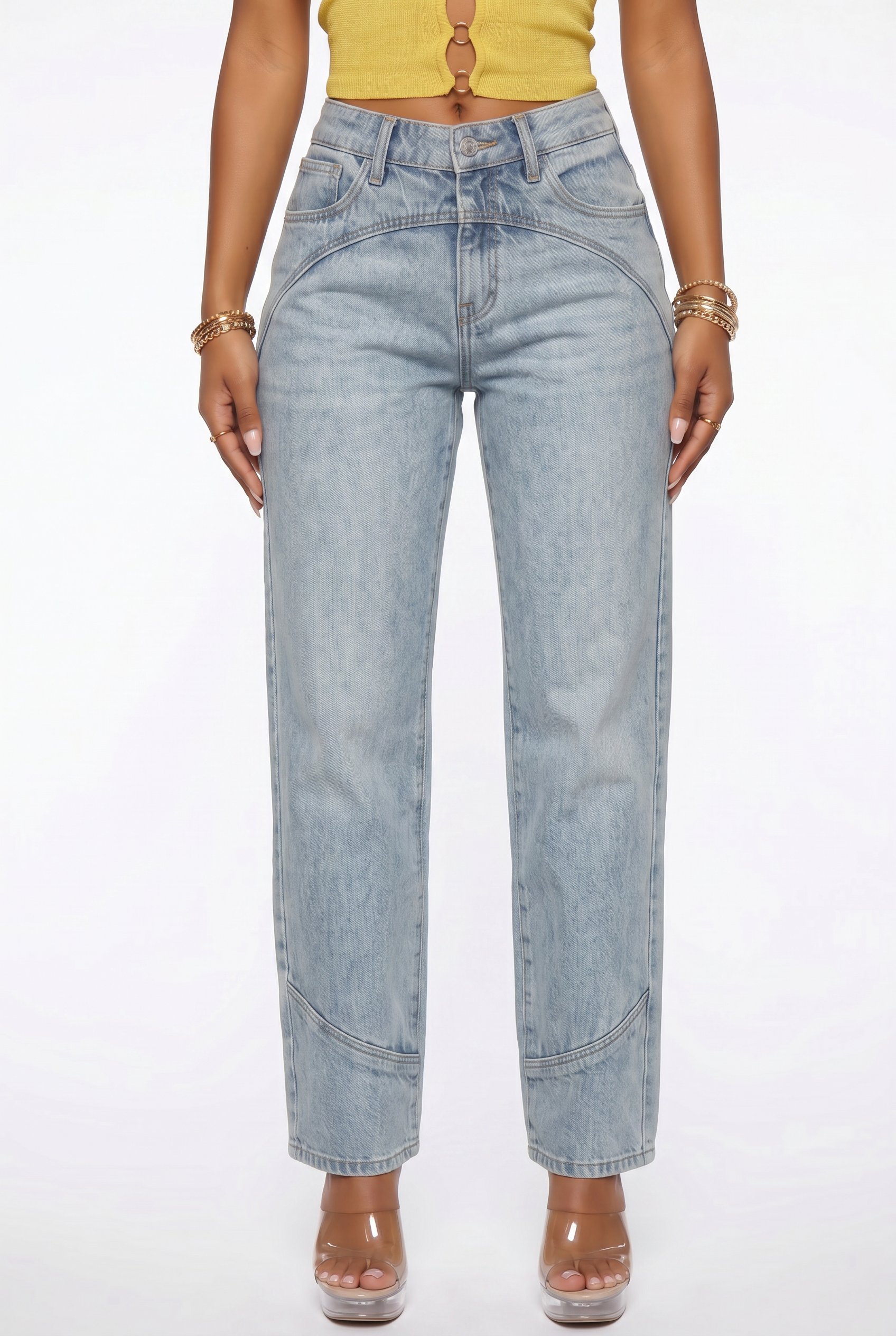 Person wearing light blue jeans on a white background