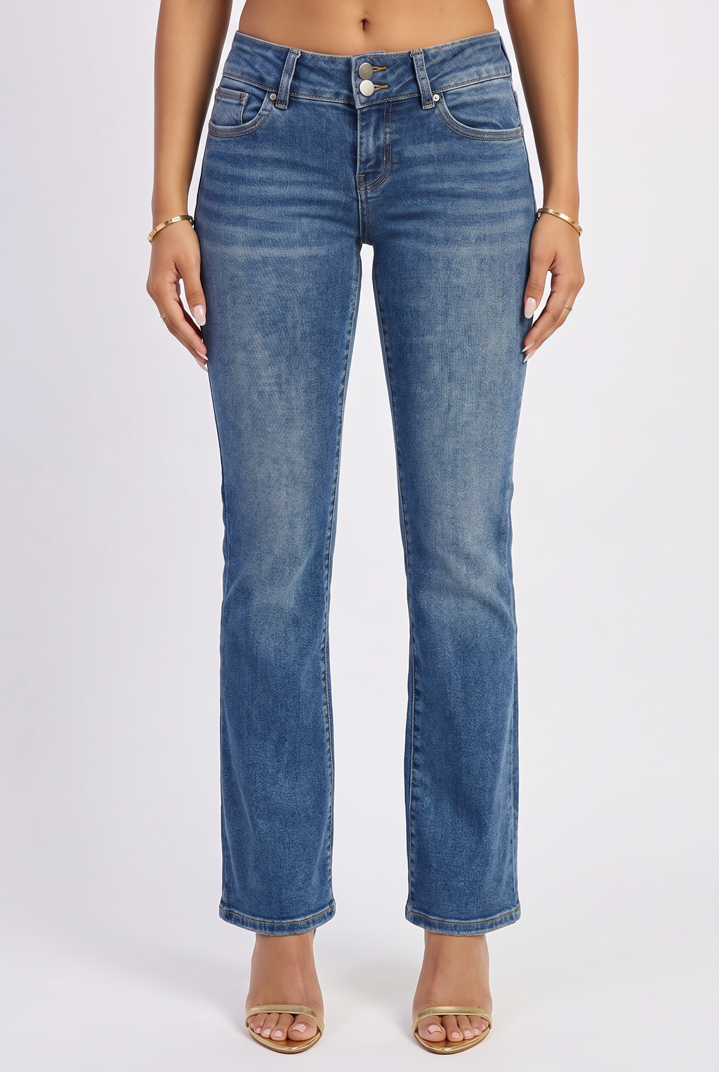 Blue jeans worn by a person on a white background