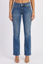 Blue jeans worn by a person on a white background