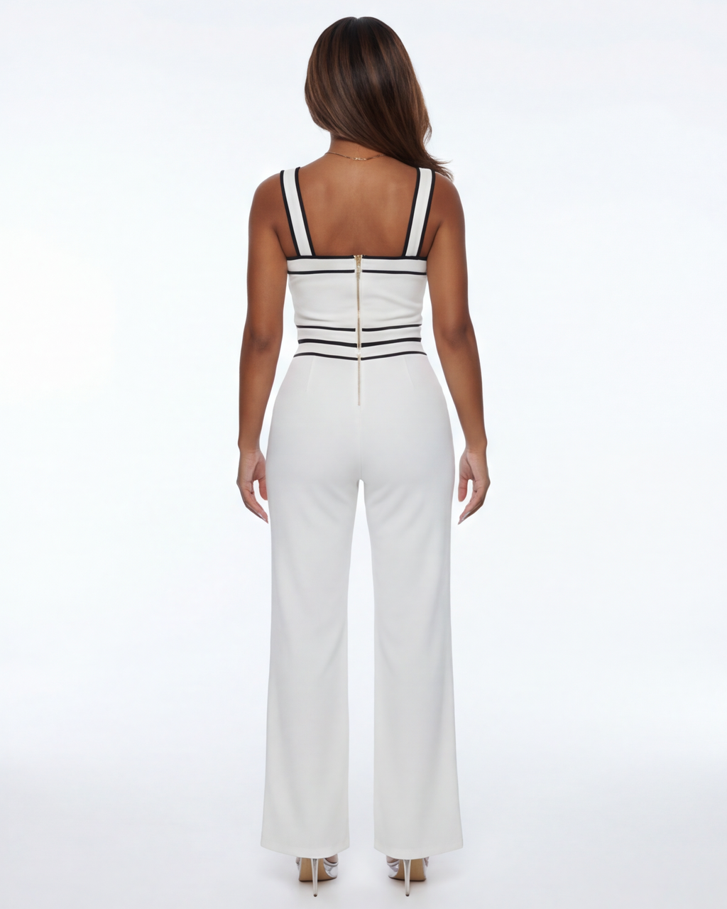 White jumpsuit with thin straps on a white background