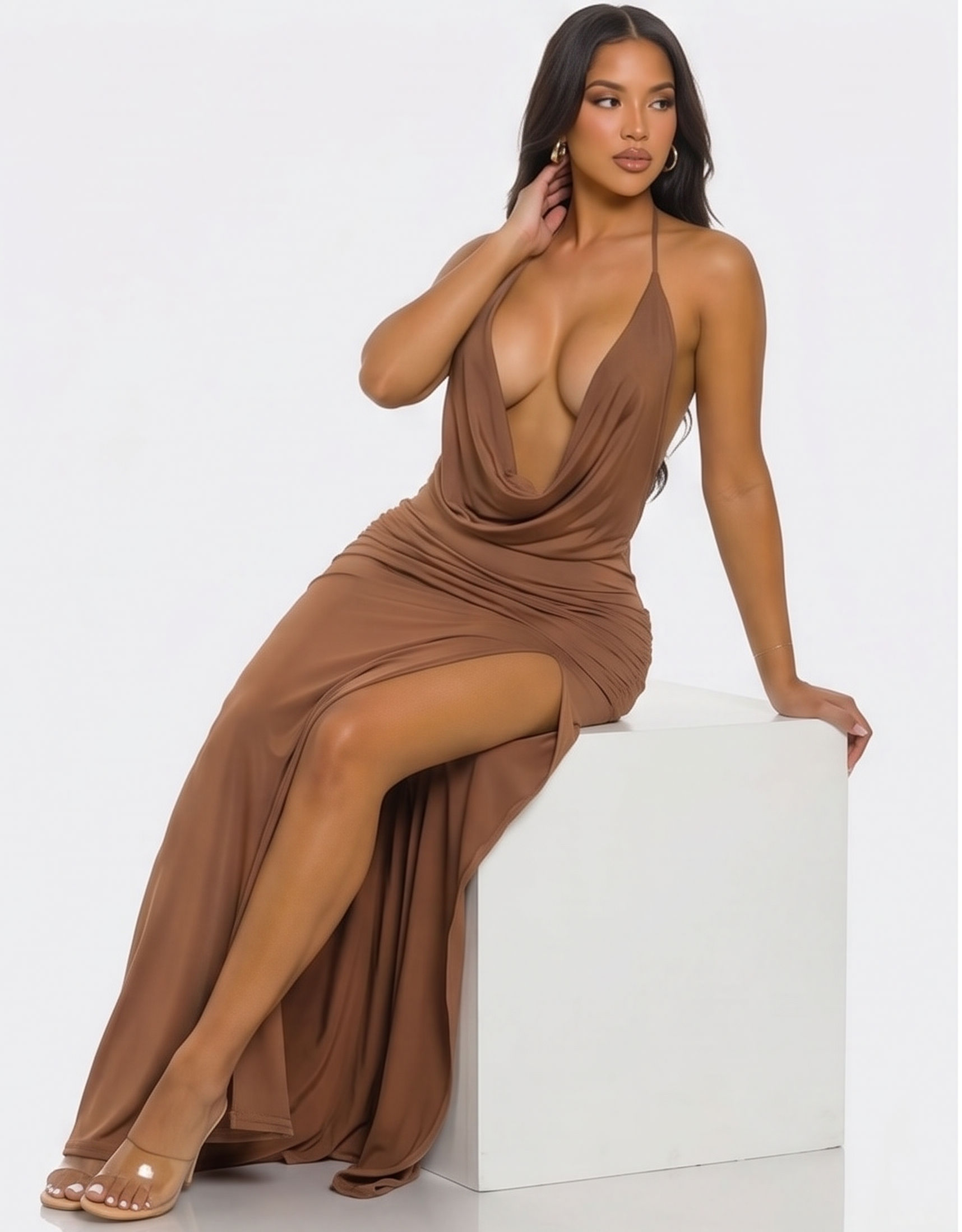 Brown evening gown worn by a model on a white background