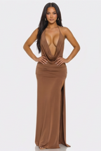 Woman wearing a brown evening gown on a white background