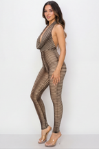 Woman wearing a brown and black striped jumpsuit on a white background